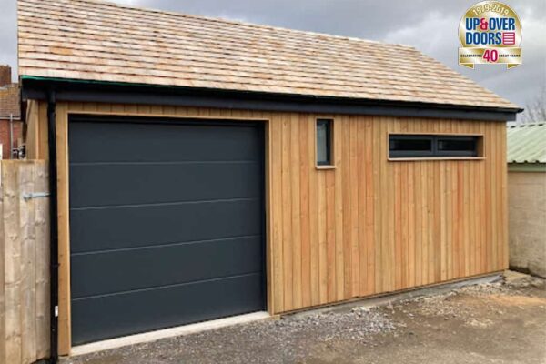 AluTech L Rib Insulated Sectional Door in Anthracite Grey on Timber Building