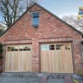 Pair of Cedar Door Trent Timber Sectional Doors in Light Oak with Matching Timber Frames