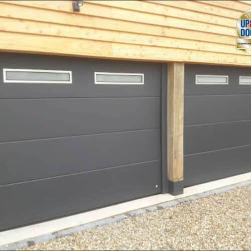 Ryterna Flush Insulated Sectional Door in Anthracite Grey with Stainless Steel Slim Windows and Custom Trim for Timber