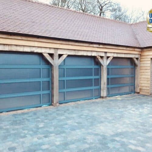 Ryterna Glazed Full Vision Sectional Garage Doors on Oak Frame Building