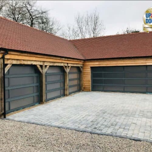 Ryterna Glazed Full Vision Sectional Garage Doors on Oak Frame Building