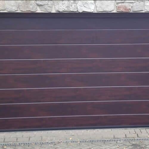 Ryterna MidRib Insulated Sectional Door in Rosewood with Square Stainless Steel Porthole Windows