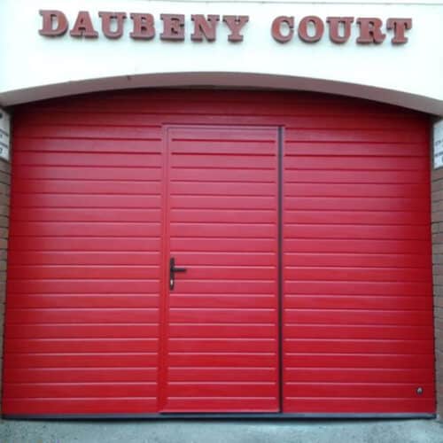 Ryterna Insulated Sectional Door in Red With Integrated Wicket Door